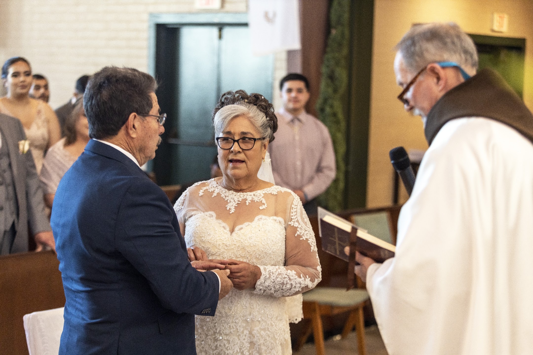 Couple exchanging vows during a church ceremony